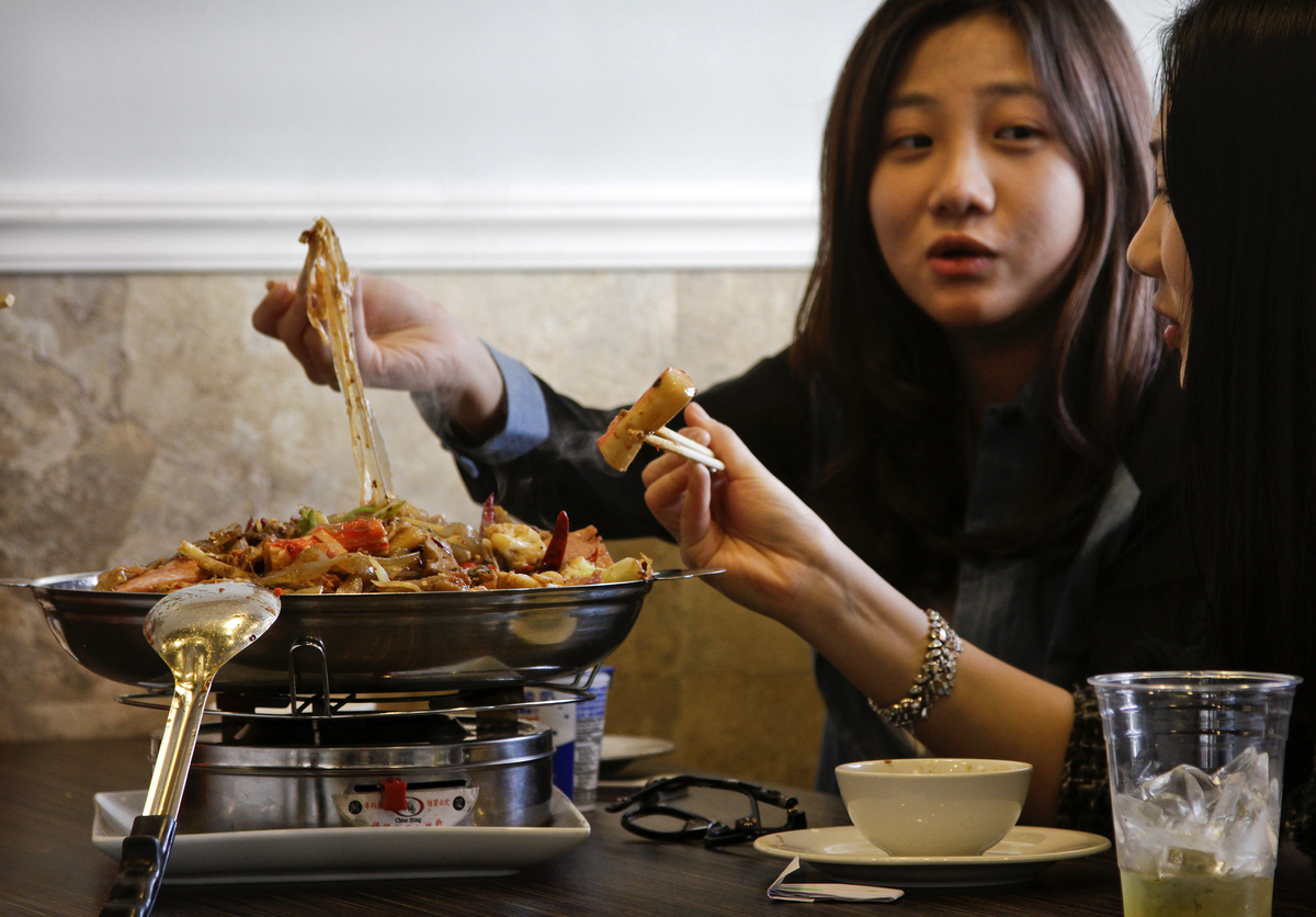 Customers eat lunch at Tasty Dining, a Chinese style restaurant.