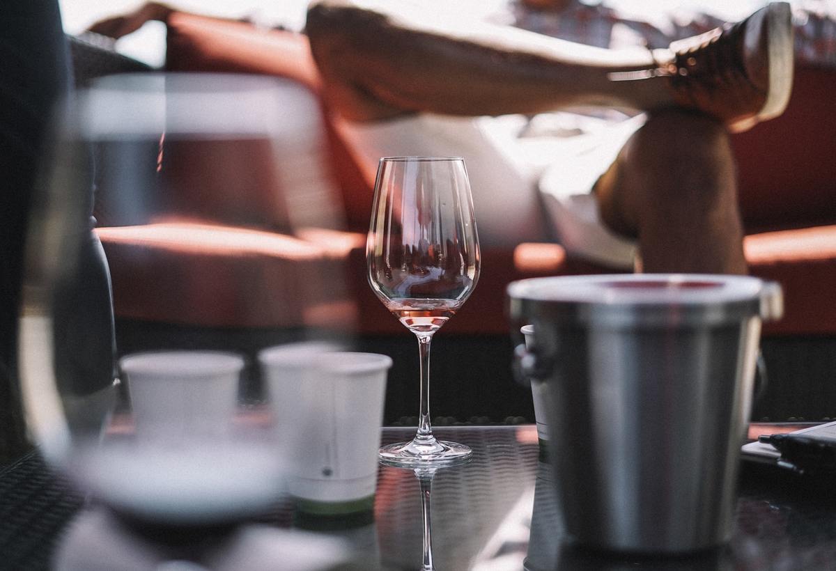 A glass sits on a living room table.